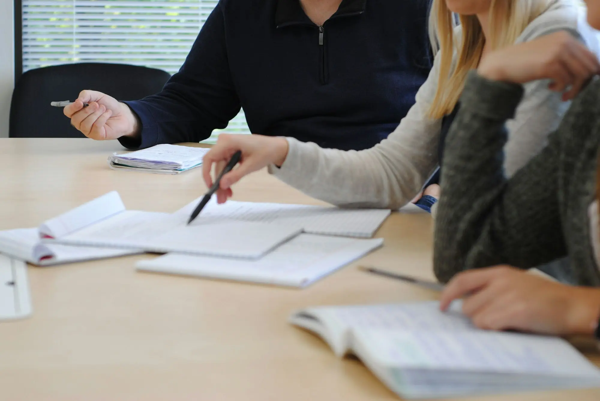 Team working through documents at a table