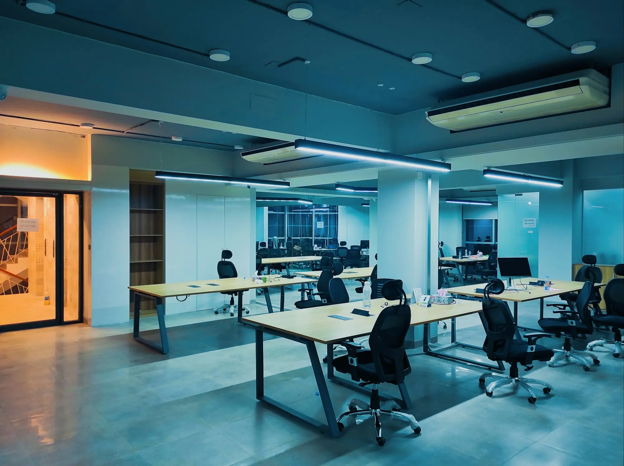 Open-plan office fit-out with desks and chairs, the kind of space a business pays to set up when it moves premises