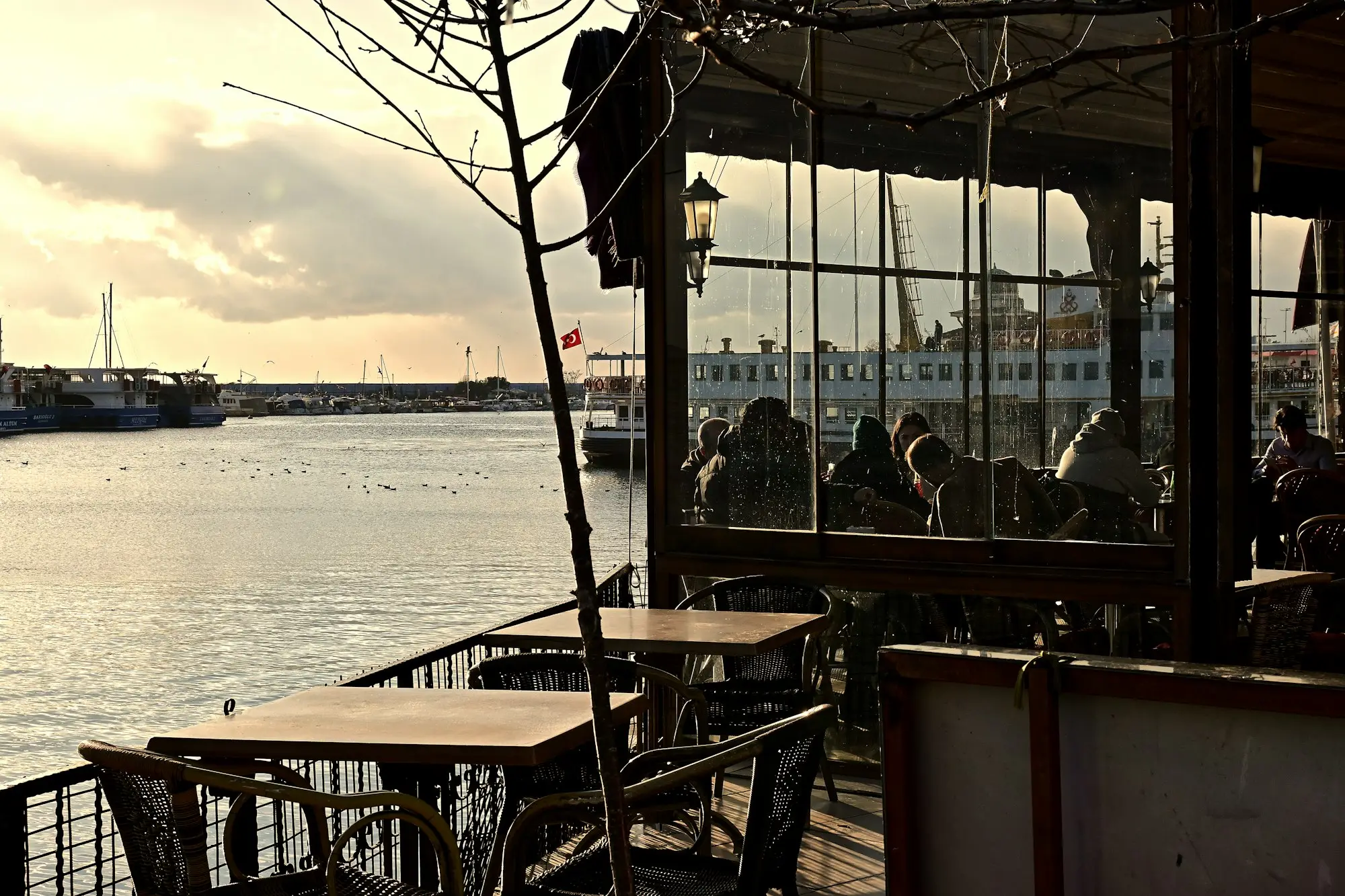 Quiet waterfront café at sunset